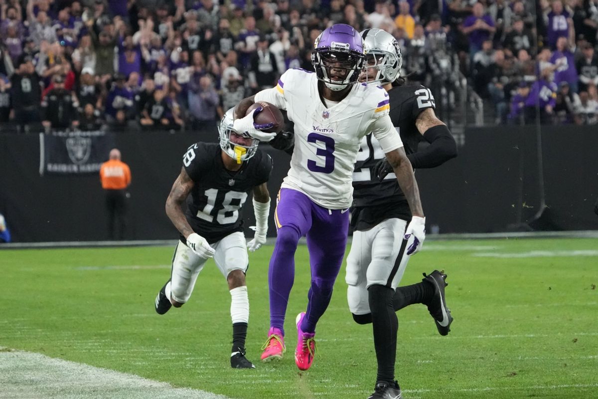 Dec 10, 2023; Paradise, Nevada, USA; Minnesota Vikings wide receiver Jordan Addison (3) carries the ball against Las Vegas Raiders cornerback Jack Jones (18) in the second half at Allegiant Stadium. Mandatory Credit: Kirby Lee-USA TODAY Sports