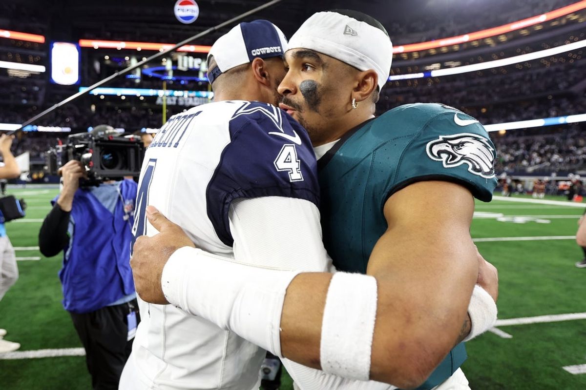 Dec 10, 2023; Arlington, Texas, USA; Dallas Cowboys quarterback Dak Prescott (4) hugs Philadelphia Eagles quarterback Jalen Hurts (1) after the game at AT&T Stadium. Mandatory Credit: Tim Heitman-Imagn Images