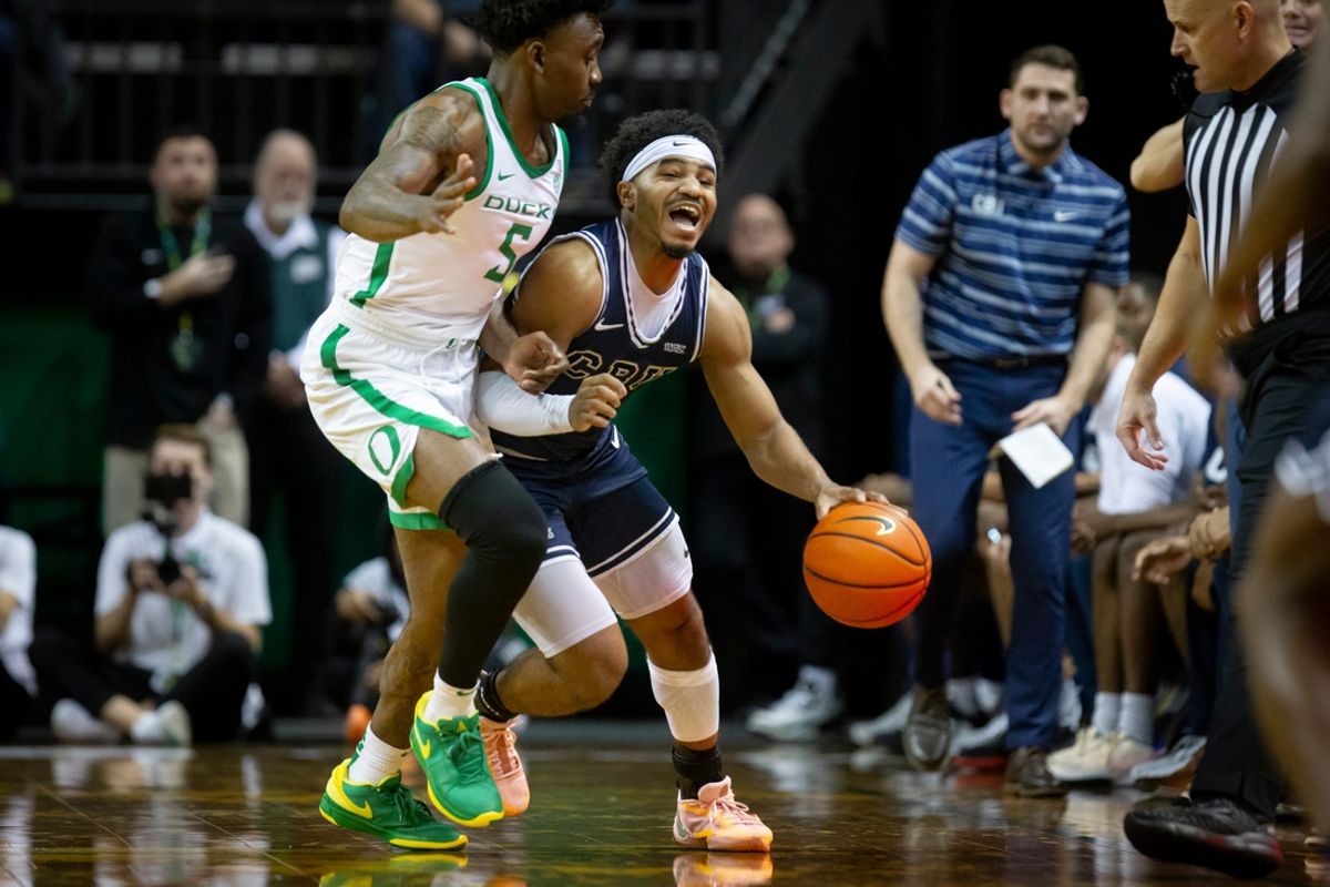 Oregon guard Jermaine Couisnard fouls California Baptist guard Dominique Daniels Jr. as the Oregon Ducks host California Baptist Tuesday, Dec. 12, 2023, at Matthew Knight Arena in Eugene, Ore.
