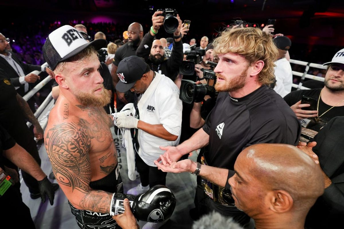 Dec 15, 2023; Orlando, Florida, USA;  Jake Paul is congratulated by Logan Paul after knocking out Andre August in the first round at the Caribe Royale Orlando. Mandatory Credit: Nathan Ray Seebeck-USA TODAY Sports