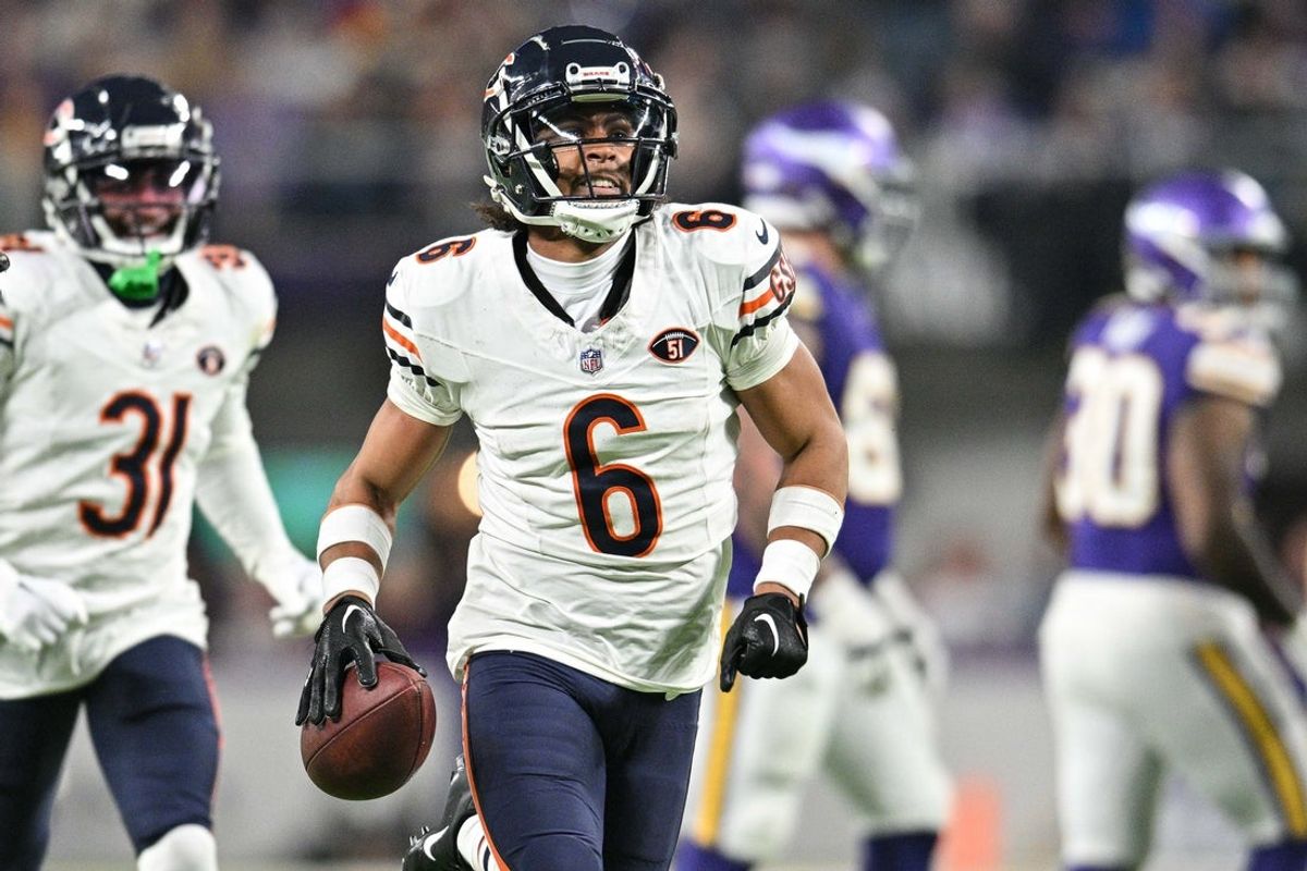 Nov 27, 2023; Minneapolis, Minnesota, USA; Chicago Bears cornerback Kyler Gordon (6) reacts after an interception off Minnesota Vikings quarterback Joshua Dobbs (not pictured) during the fourth quarter at U.S. Bank Stadium. Mandatory Credit: Jeffrey Becker-Imagn Images