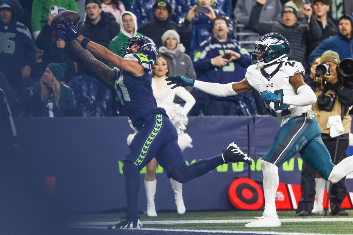 Dec 18, 2023; Seattle, Washington, USA; Seattle Seahawks wide receiver Jaxon Smith-Njigba (11) catches a touchdown pass against Philadelphia Eagles cornerback James Bradberry (24) during the fourth quarter at Lumen Field. Mandatory Credit: Joe Nicholson-USA TODAY Sports