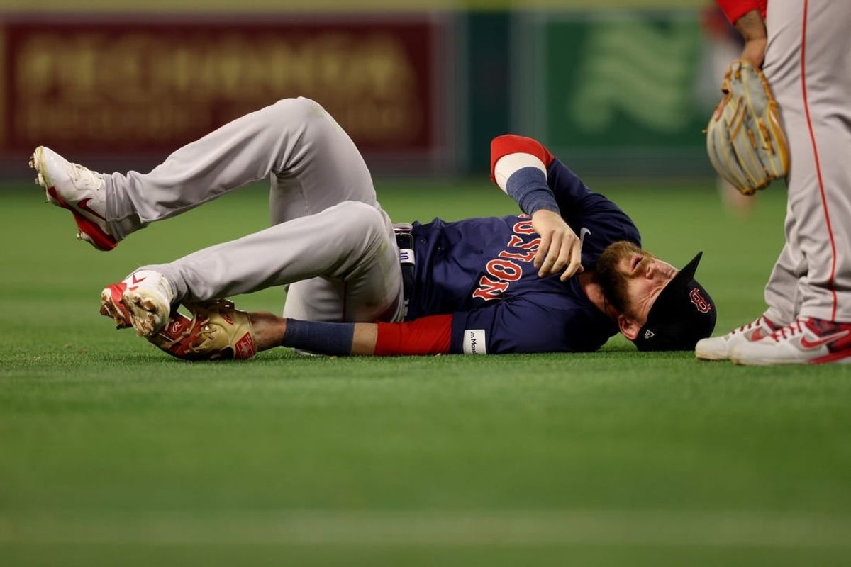 Apr 5, 2024; Anaheim, California, USA; Boston Red Sox shortstop Trevor Story (10) reacts after an injury during the fourth inning against the Los Angeles Angels at Angel Stadium.