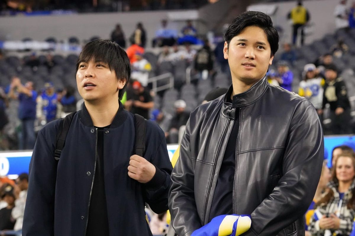 Dec 21, 2023; Inglewood, California, USA; Los Angeles Dodgers player Shohei Ohtani (right) and interpreter Ippei Mizuhara attend the game between the Los Angeles Rams and the New Orleans Saints at SoFi Stadium. Mandatory Credit: Kirby Lee-Imagn Images