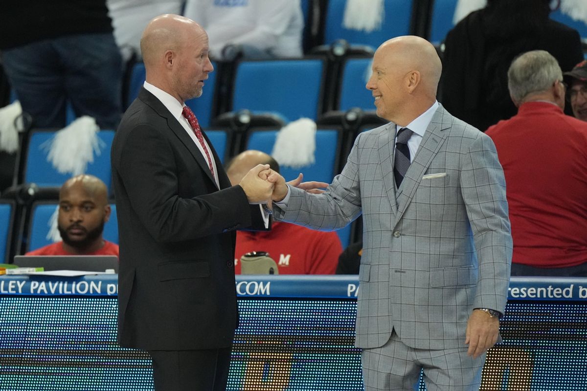 Dec 22, 2023; Los Angeles, California, USA; Maryland Terrapins head coach Kevin Willard (left) and UCLA Bruins head coach MIck Cronin shake hands during the game at Pauley Pavilion presented by Wescom. Mandatory Credit: Kirby Lee-Imagn Images