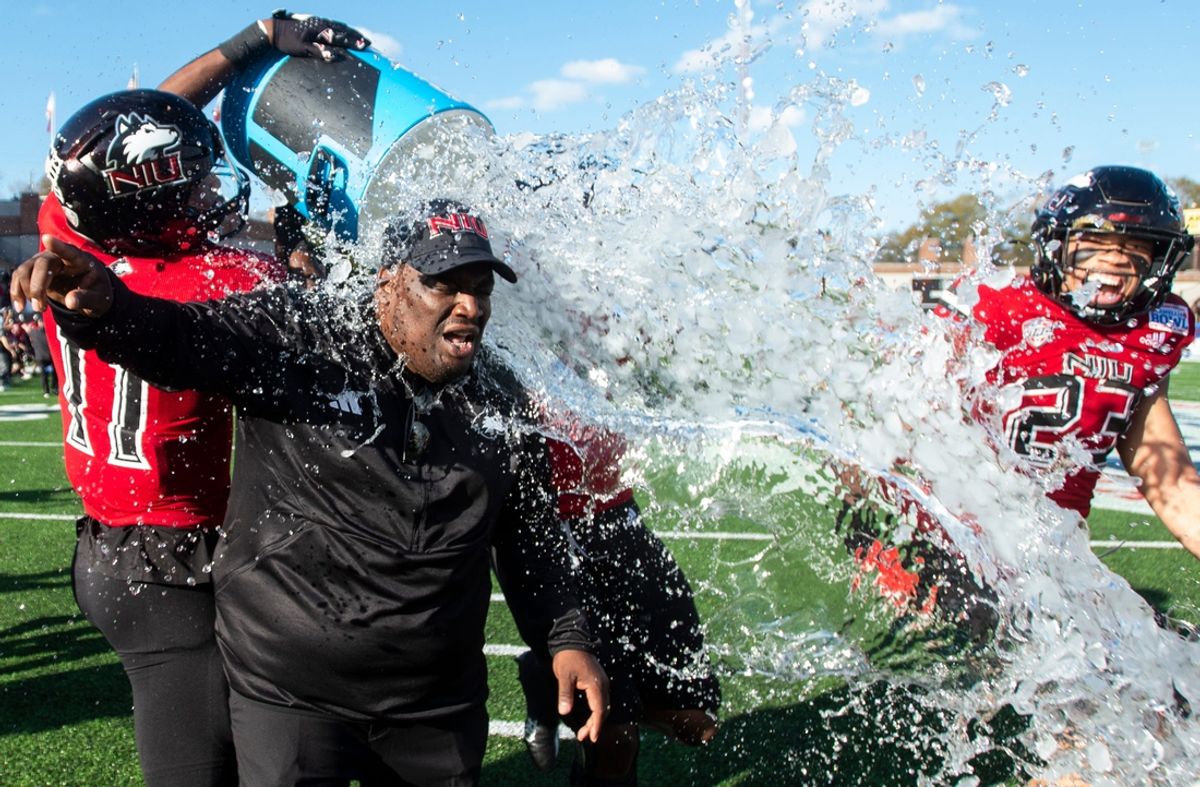Camellia Bowl: Northern Illinois head coach Thomas Hammock gets doused after the Huskies defeated Arkansas State.
