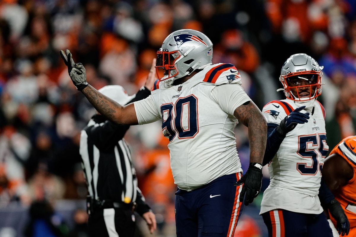Dec 24, 2023; Denver, Colorado, USA; New England Patriots defensive tackle Christian Barmore (90) reacts after a play ]in the third quarter against the Denver Broncos at Empower Field at Mile High. Mandatory Credit: Isaiah J. Downing-Imagn Images
