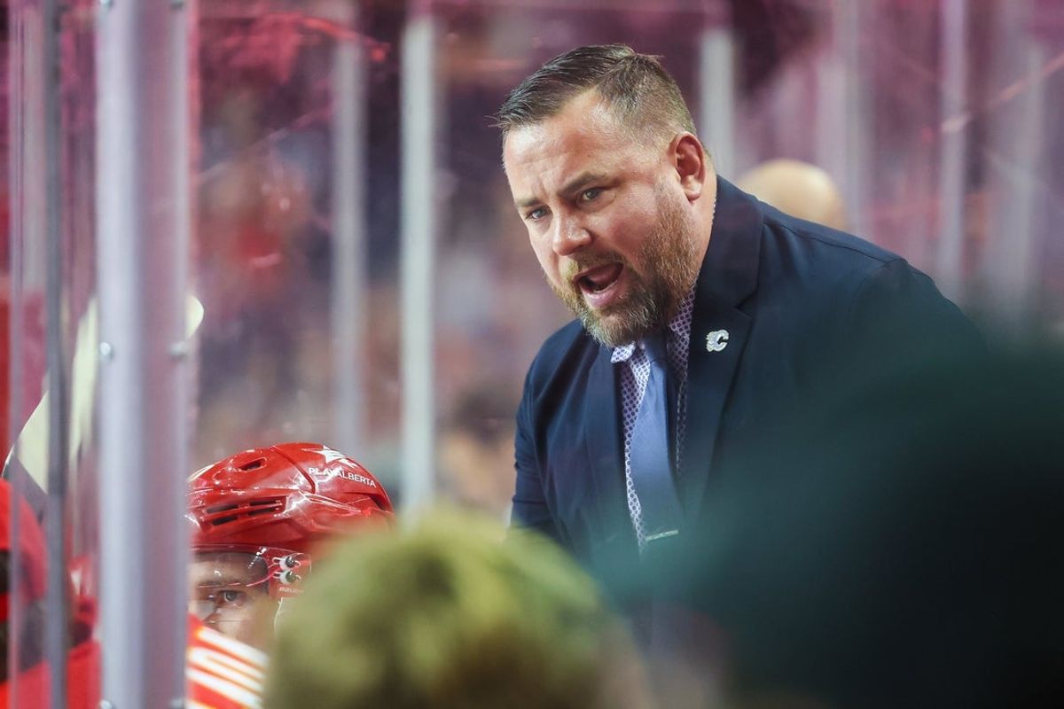 Dec 27, 2023; Calgary, Alberta, CAN; Calgary Flames Assistant coach Marc Savard during the second period on his bench against the Seattle Kraken at Scotiabank Saddledome. Mandatory Credit: Sergei Belski-Imagn Images