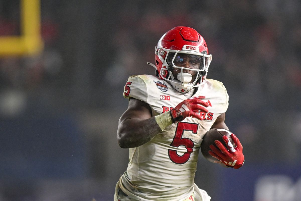 Dec 28, 2023; Bronx, NY, USA; Rutgers Scarlet Knights running back Kyle Monangai (5) runs with the ball against the Miami Hurricanes during the fourth quarter at Yankee Stadium. Mandatory Credit: Mark Smith-Imagn Images