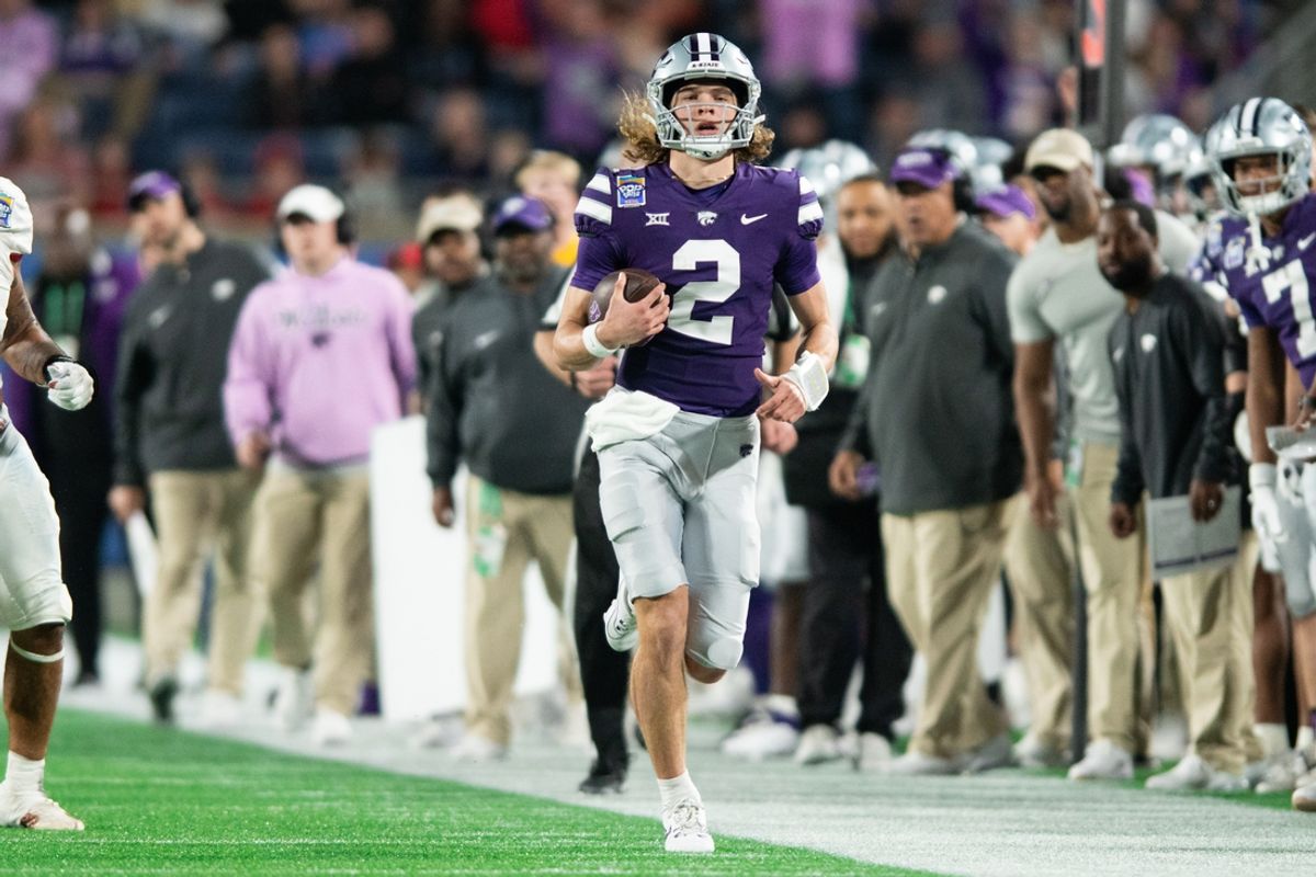 Dec 28, 2023; Orlando, FL, USA; Kansas State quarterback Avery Johnson (2) runs the ball against NC State in the fourth quarter at Camping World Stadium. Mandatory Credit: Jeremy Reper-USA TODAY Sports