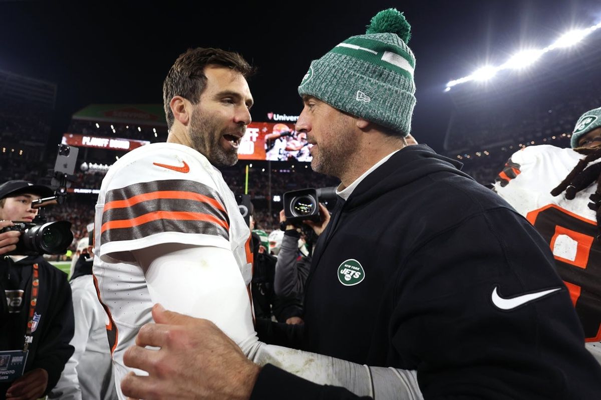 Dec 28, 2023; Cleveland, Ohio, USA; Cleveland Browns quarterback Joe Flacco (left) and New York Jets quarterback Aaron Rodgers (right) meet after the game at Cleveland Browns Stadium. Mandatory Credit: Scott Galvin-Imagn Images