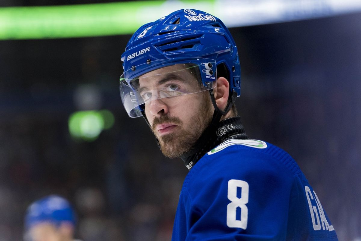 Dec 28, 2023; Vancouver, British Columbia, CAN; Vancouver Canucks forward Conor Garland (8) wearing a neck guard during a stop in play against the Philadelphia Flyers in the third period at Rogers Arena. Flyers won 4-1. Mandatory Credit: Bob Frid-USA TODAY Sports