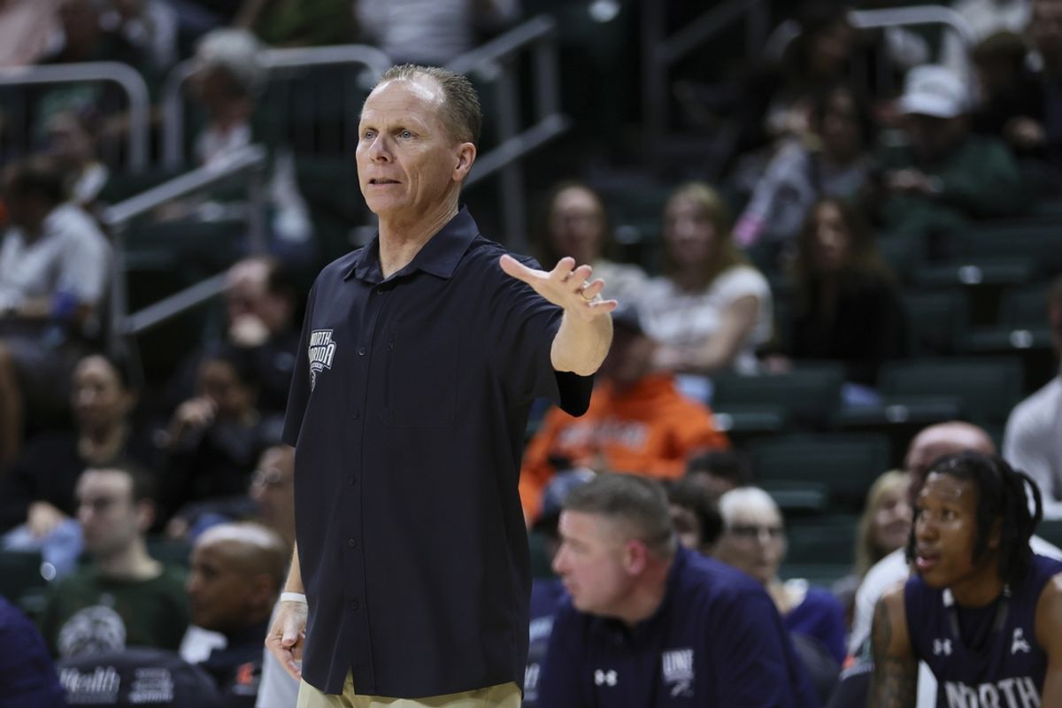 Dec 29, 2023; Coral Gables, Florida, USA; North Florida Ospreys head coach Matthew Driscoll reacts from the sideline against the Miami Hurricanes during the first half at Watsco Center. Mandatory Credit: Sam Navarro-Imagn Images