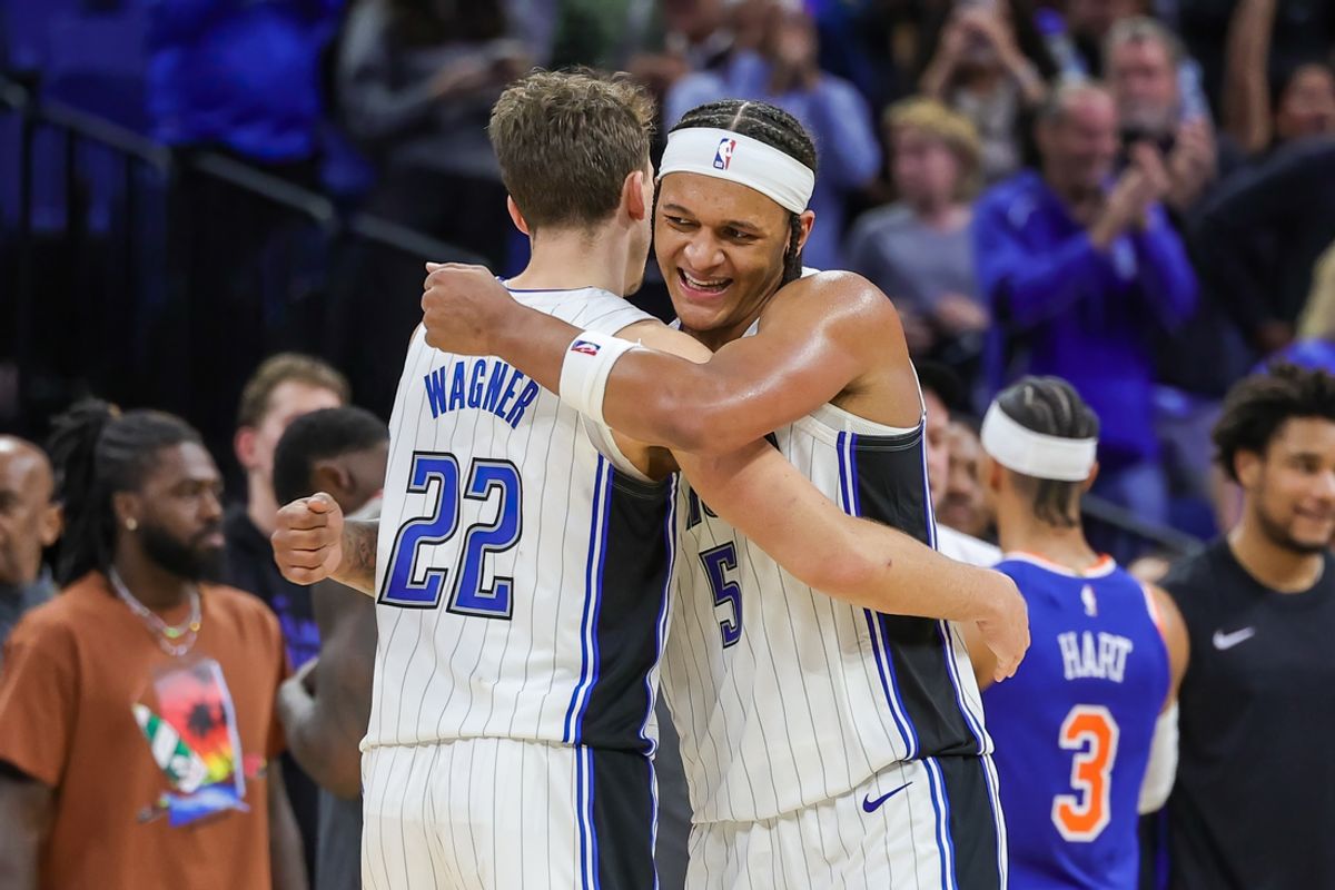 Dec 29, 2023; Orlando, Florida, USA; Orlando Magic forward Franz Wagner (22) and forward Paolo Banchero (5) celebrate their 117-108 win against the New York Knicks at KIA Center. Mandatory Credit: Mike Watters-Imagn Images