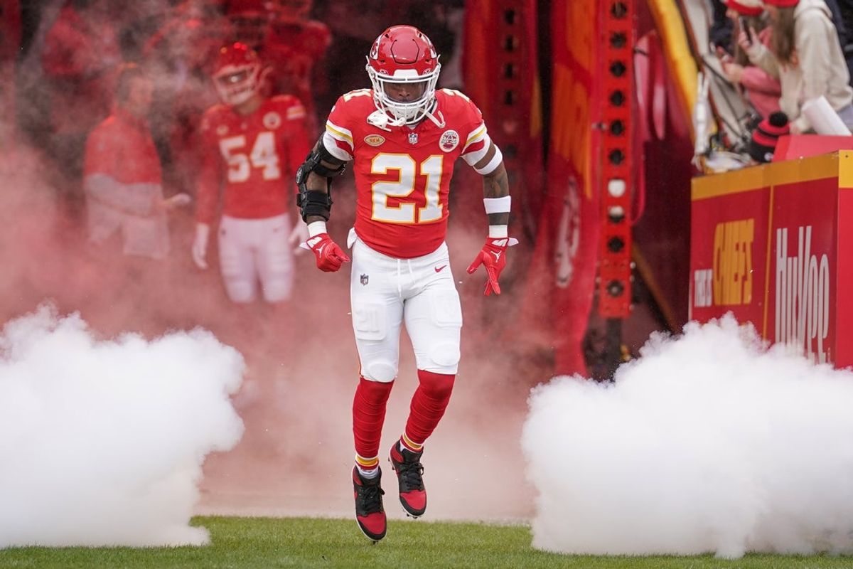 Dec 25, 2023; Kansas City, Missouri, USA; Kansas City Chiefs safety Mike Edwards (21) is introduced against the Las Vegas Raiders prior to a game at GEHA Field at Arrowhead Stadium. Mandatory Credit: Denny Medley-Imagn Images