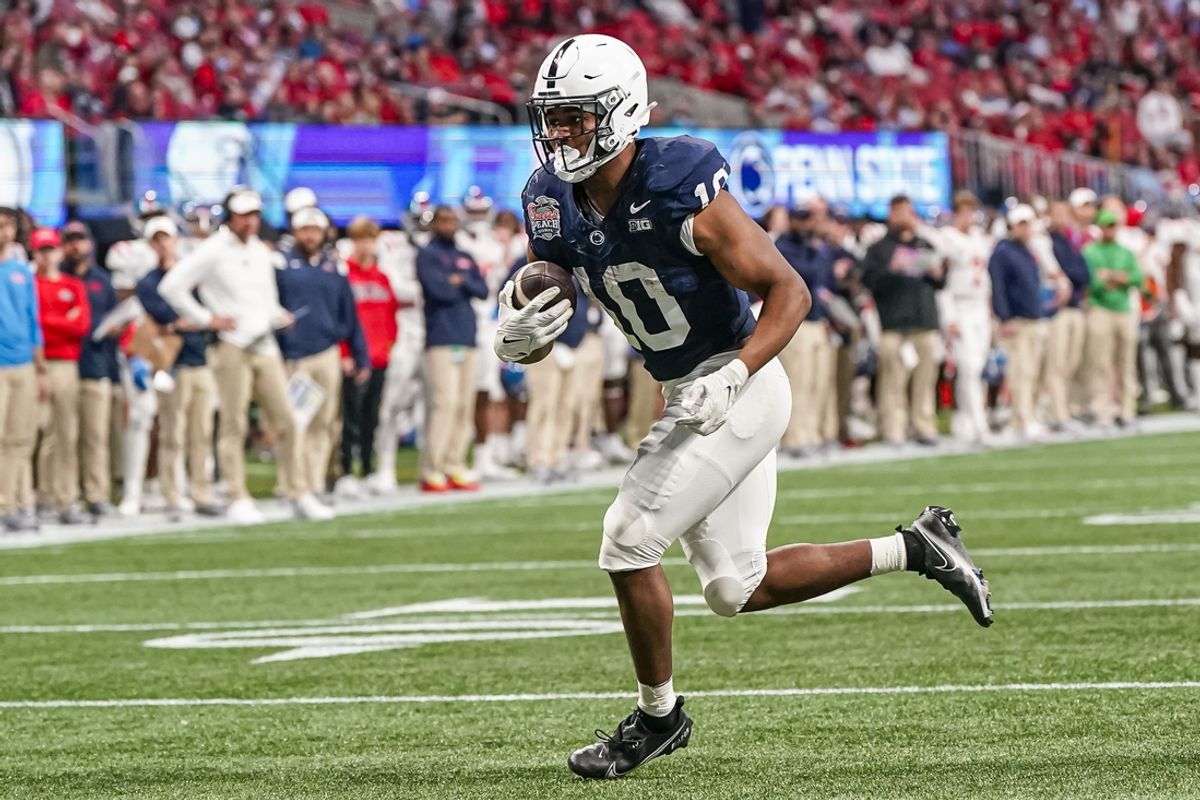 Dec 30, 2023; Atlanta, GA, USA; Penn State Nittany Lions running back Nicholas Singleton (10) catches a pass and runs for a two point conversion against the Mississippi Rebels during the second half at Mercedes-Benz Stadium. Mandatory Credit: Dale Zanine-Imagn Images
