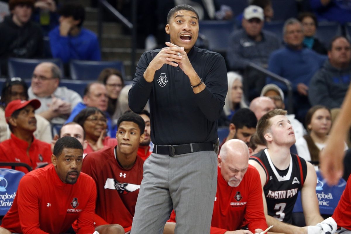 Dec 30, 2023; Memphis, Tennessee, USA; Austin Peay Governors head coach Corey Gipson gives direction during the first half against the Memphis Tigers at FedExForum. Mandatory Credit: Petre Thomas-Imagn Images