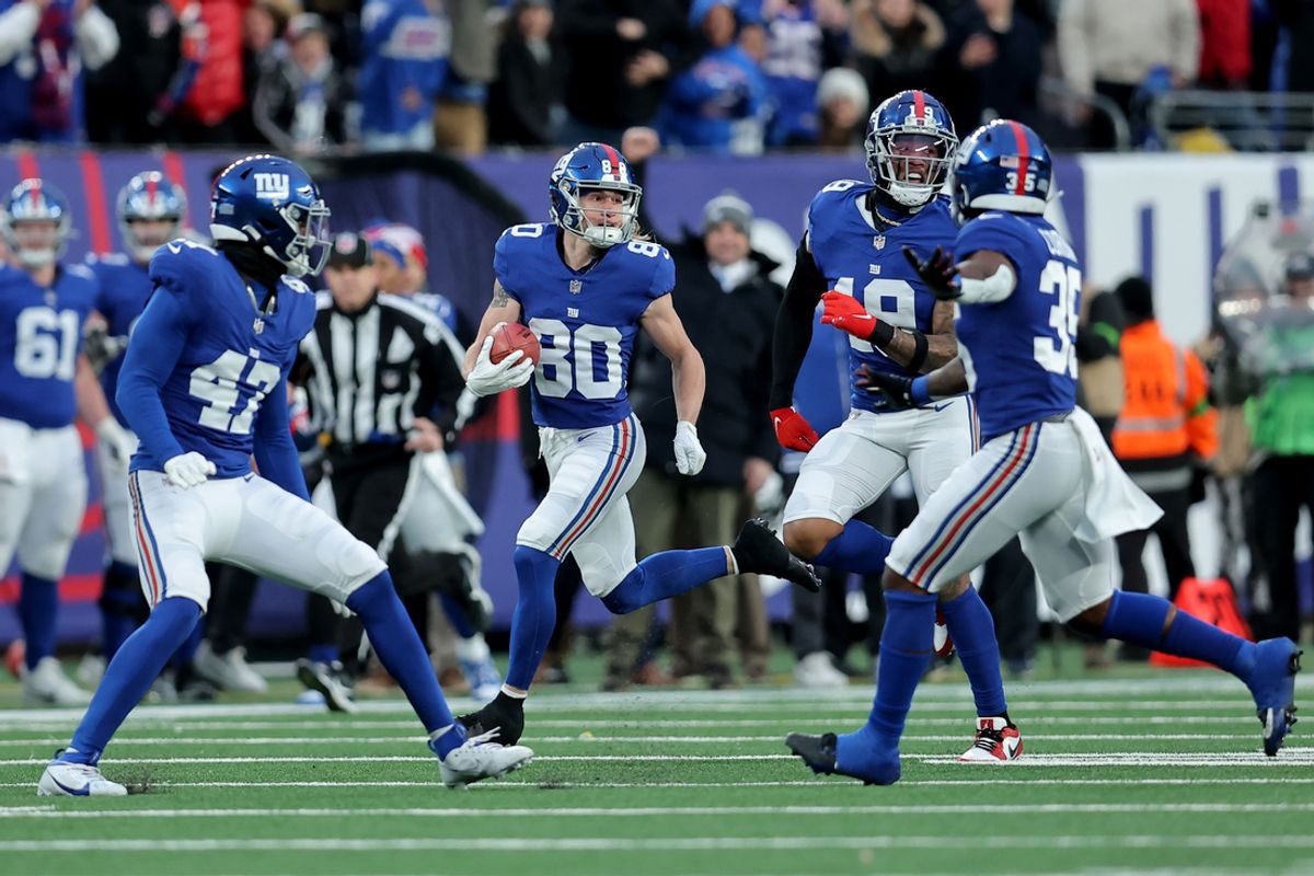 Dec 31, 2023; East Rutherford, New Jersey, USA; New York Giants wide receiver Gunner Olszewski (80) runs back a punt for a touchdown against the Los Angeles Rams during the fourth quarter at MetLife Stadium. Mandatory Credit: Brad Penner-Imagn Images