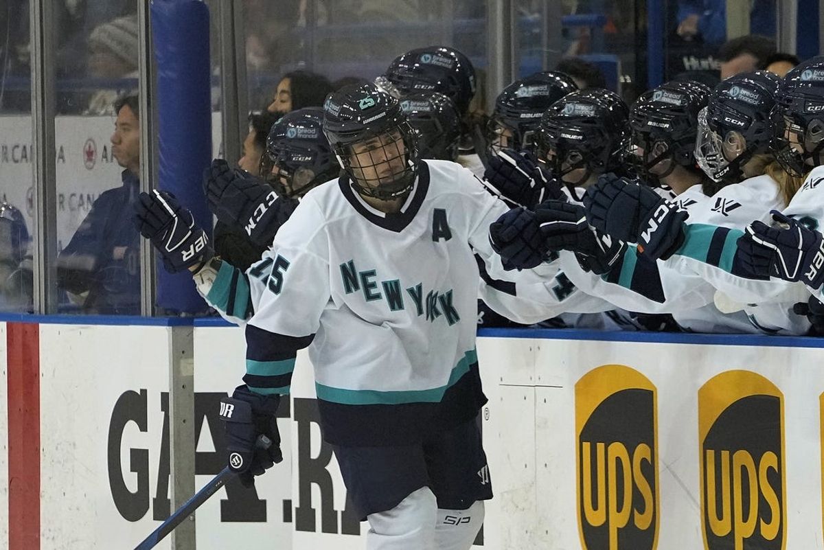 Jan 1, 2024; Toronto, Ontario, CANADA; New York forward Alex Carpenter (25) gets congratulated after scoring against Toronto during the third period of the inaugural PWHL ice hockey game at Mattamy Athletic Centre. Mandatory Credit: John E. Sokolowski-USA TODAY Sports