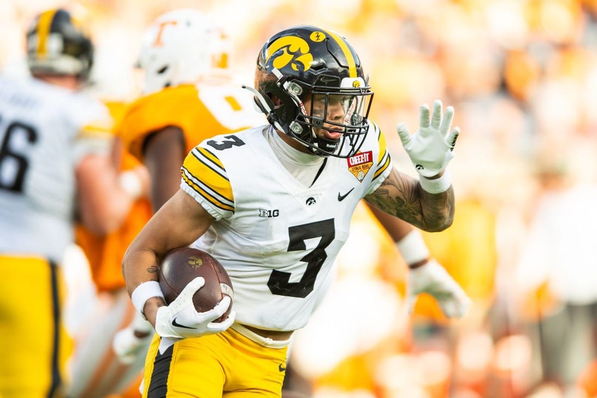 Jan 1, 2024; Orlando, FL, USA; Iowa Hawkeyes wide receiver Kaleb Brown (3) runs the ball against the Tennessee Volunteers in the fourth quarter at Camping World Stadium. Mandatory Credit: Jeremy Reper-USA TODAY Sports
