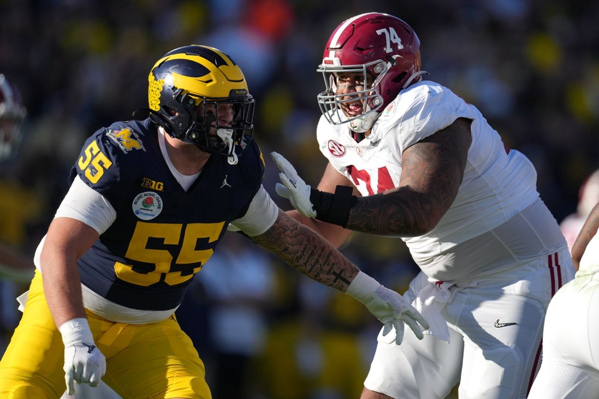Jan 1, 2024; Pasadena, CA, USA; Alabama Crimson Tide offensive lineman Kadyn Proctor (74) blocks Michigan Wolverines defensive lineman Mason Graham (55) during the first half in the 2024 Rose Bowl college football playoff semifinal game at Rose Bowl. Mandatory Credit: Kirby Lee-Imagn Images