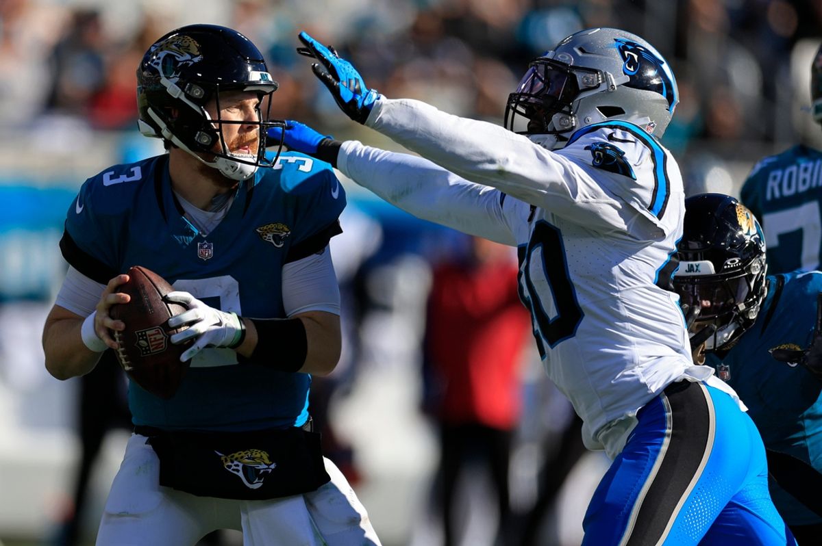 Jacksonville Jaguars quarterback C.J. Beathard (3) is sacked by Carolina Panthers linebacker Deion Jones (40) during the second quarter of a regular season NFL football matchup Sunday, Dec. 31, 2023 at EverBank Stadium in Jacksonville, Fla. The Jacksonville Jaguars blanked the Carolina Panthers 26-0. [Corey Perrine/Florida Times-Union]