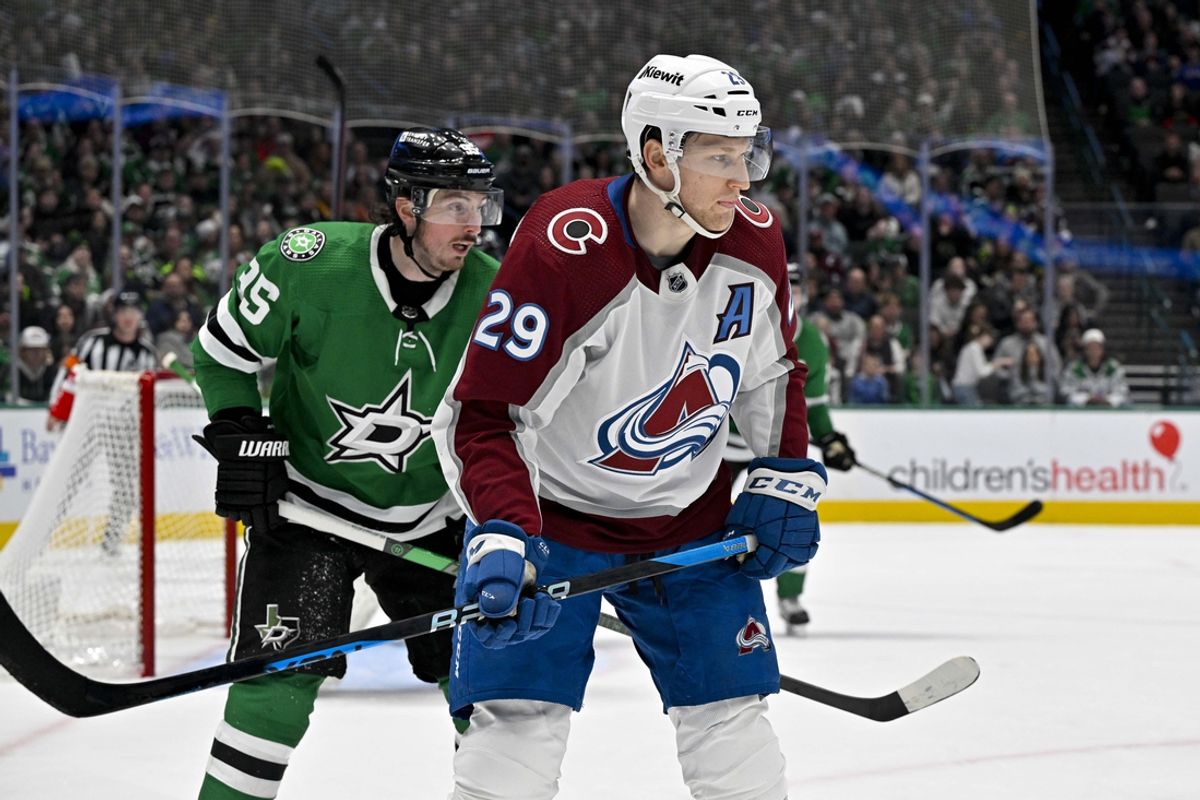 Jan 4, 2024; Dallas, Texas, USA; Dallas Stars center Matt Duchene (95) and Colorado Avalanche center Nathan MacKinnon (29) look for the puck in the Stars zone during the third period at the American Airlines Center. Mandatory Credit: Jerome Miron-Imagn Images