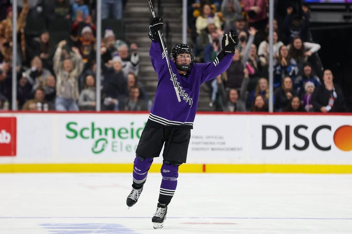 Jan 6, 2024; St. Paul, Minnesota, USA; Minnesota forward Grace Zumwinkle (13) celebrates her hat trick during the third period against Montreal in a PWHL ice hockey game at XCel Energy Center. Zumwinkle scored the first hat trick in PWHL history. Mandatory Credit: Matt Krohn-USA TODAY Sports