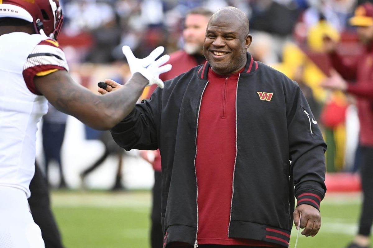 Jan 7, 2024; Landover, Maryland, USA; Washington Commanders offensive coordinator Eric Bieniemy on the field before the game against the Dallas Cowboys at FedExField. Mandatory Credit: Brad Mills-Imagn Images