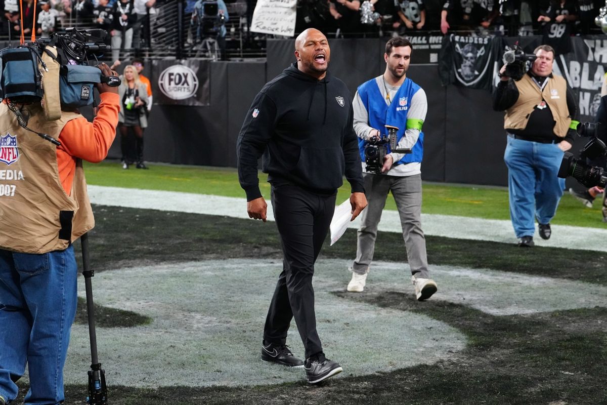 Jan 7, 2024; Paradise, Nevada, USA; Las Vegas Raiders interim head coach Antonio Pierce cheers with fans after the Raiders defeated the Denver Broncos 27-14 at Allegiant Stadium. Mandatory Credit: Stephen R. Sylvanie-USA TODAY Sports