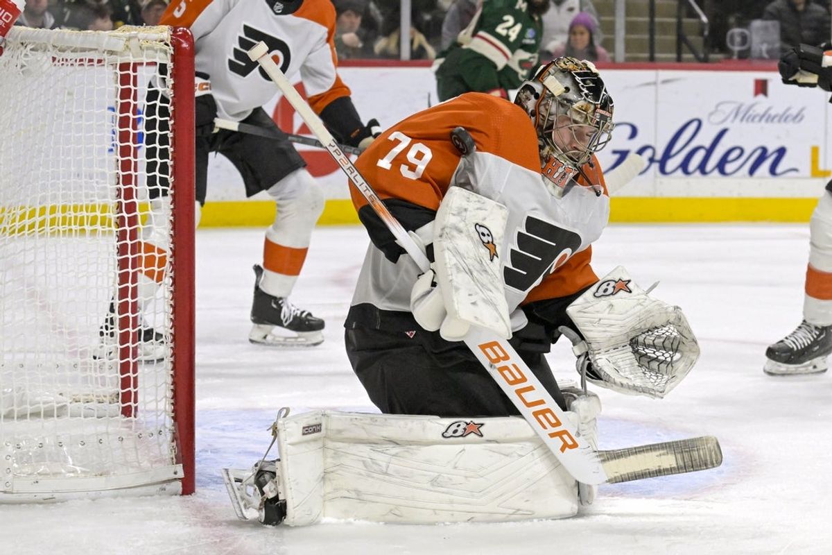 Jan 12, 2024; Saint Paul, Minnesota, USA; Philadelphia Flyers goalie Carter Hart (79) makes a save against the Minnesota Wild during the second period at Xcel Energy Center. Mandatory Credit: Nick Wosika-Imagn Images
