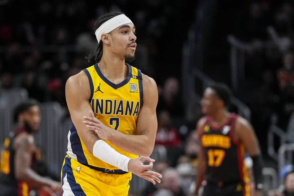 Jan 12, 2024; Atlanta, Georgia, USA; Indiana Pacers guard Andrew Nembhard (2) reacts after making a three point shot against the Atlanta Hawks during the second half at State Farm Arena. Mandatory Credit: Dale Zanine-USA TODAY Sports