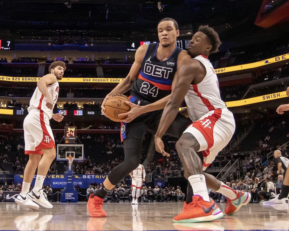 Jan 12, 2024; Detroit, Michigan, USA; Detroit Pistons forward Kevin Knox II (24) battles for the ball with Houston Rockets forward Jae'Sean Tate (8) during the in the first half at Little Caesars Arena. Mandatory Credit: David Reginek-Imagn Images