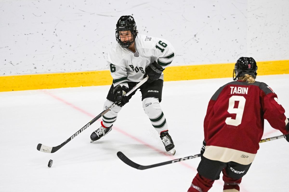 Jan 13, 2024; Montreal, Quebec, CANADA; Boston forward Amanda Pelkey (16) plays the puck against Montreal defender Kati Tabin (9) during overtime in a PWHL ice hockey game at Verdun Auditorium. Mandatory Credit: David Kirouac-Imagn Images