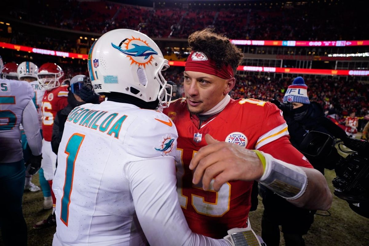 Jan 13, 2024; Kansas City, Missouri, USA; Kansas City Chiefs quarterback Patrick Mahomes (15) meets with Miami Dolphins quarterback Tua Tagovailoa (1) following the 2024 AFC wild card game at GEHA Field at Arrowhead Stadium. Mandatory Credit: Jay Biggerstaff-Imagn Images