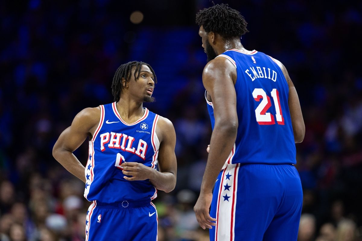 Jan 15, 2024; Philadelphia, Pennsylvania, USA; Philadelphia 76ers center Joel Embiid (21) and guard Tyrese Maxey (0) talk during a break in action in the first quarter against the Houston Rockets at Wells Fargo Center. Mandatory Credit: Bill Streicher-Imagn Images