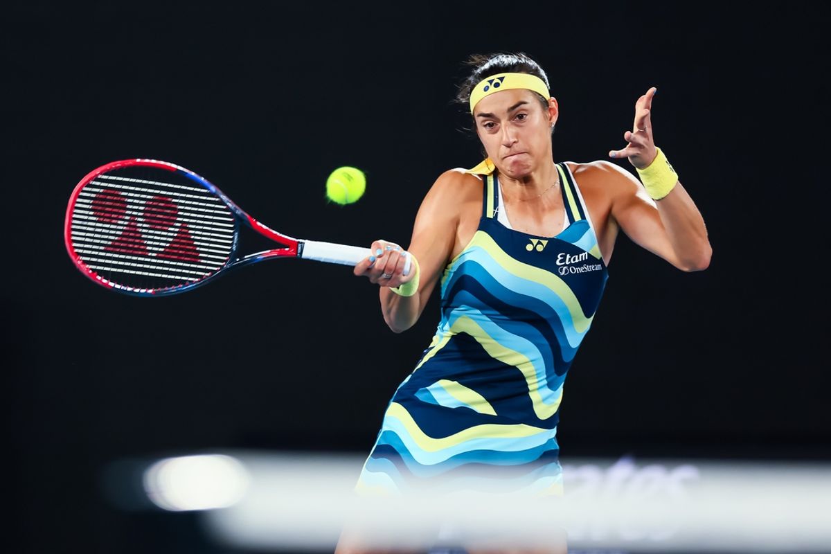 Jan 15, 2024; Melbourne, Victoria, Australia; Caroline Garcia of France plays a shot against Naomi Osaka (not pictured) of Japan in Round 1 of the Women's Singles on Day 2 of the Australian Open tennis at Rod Laver Arena. Mandatory Credit: Mike Frey-Imagn Images