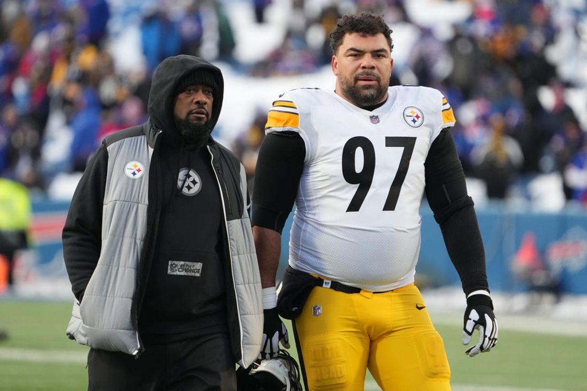 Jan 15, 2024; Orchard Park, New York, USA; Pittsburgh Steelers head coach Mike Tomlin walks the field with  defensive tackle Cameron Heyward (97) before the game against the Buffalo Bills in a 2024 AFC wild card game at Highmark Stadium. Mandatory Credit: Kirby Lee-USA TODAY Sports