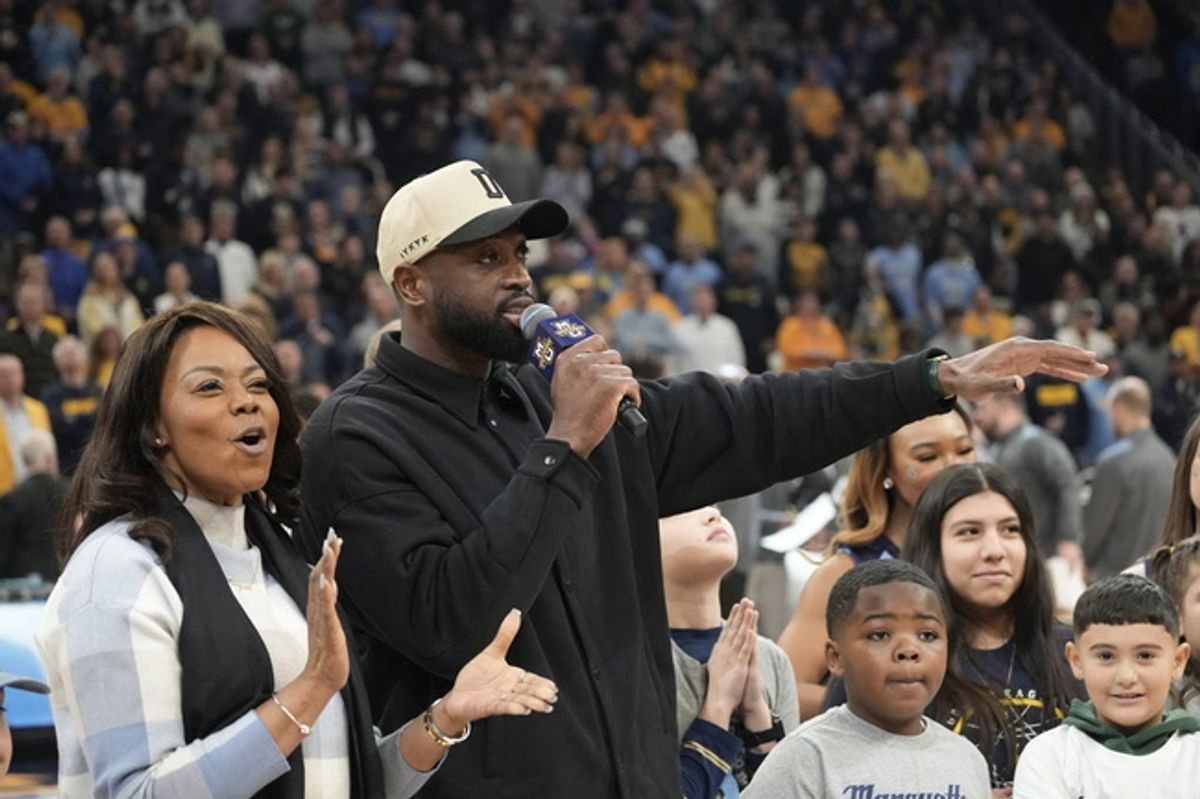 Basketball Hall of Famer Dwyane Wade talks to the crowd after it was announced that he is giving $3 million to Marquette.