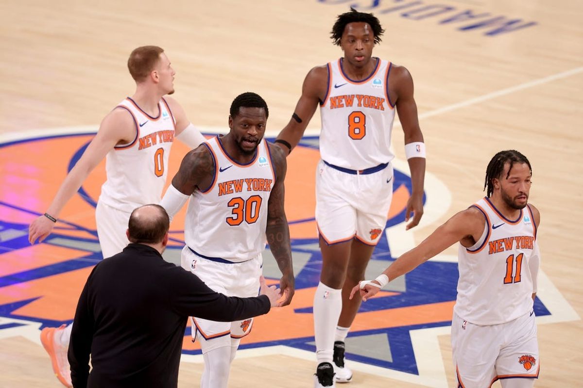Jan 18, 2024; New York, New York, USA; New York Knicks head coach Tom Thibodeau high fives New York Knicks forward Julius Randle (30) with guard Donte DiVincenzo (0) and forward OG Anunoby (8) and guard Jalen Brunson (11) during the first quarter against the Washington Wizards at Madison Square Garden. Mandatory Credit: Brad Penner-USA TODAY Sports