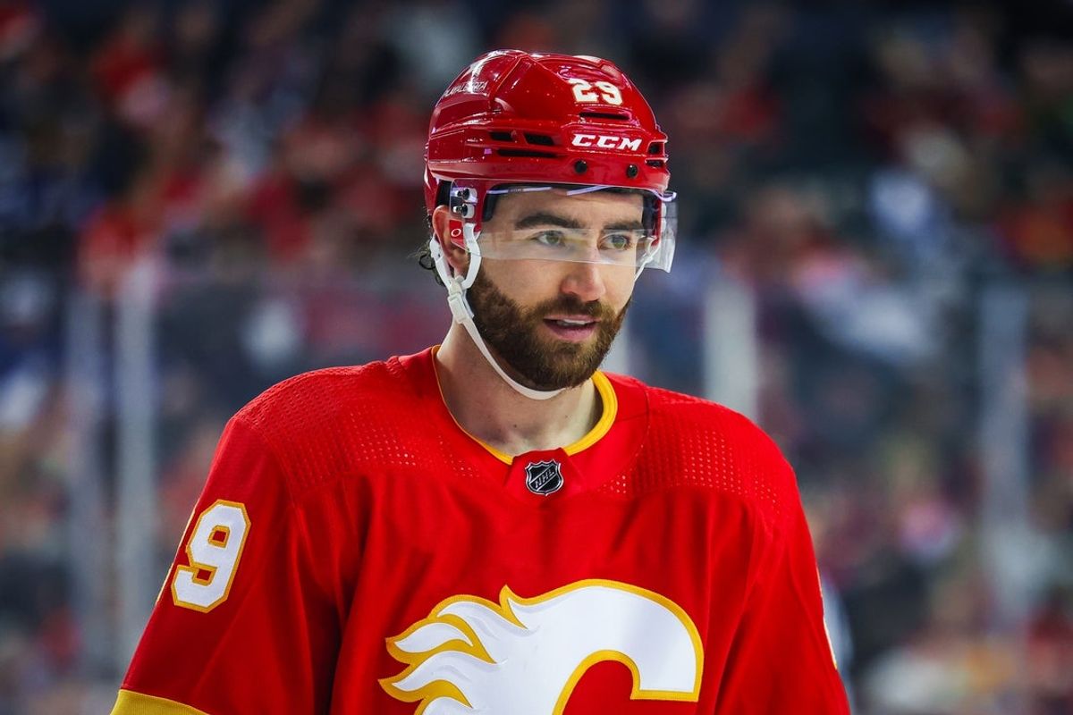 Jan 18, 2024; Calgary, Alberta, CAN; Calgary Flames center Dillon Dube (29) against the Toronto Maple Leafs during the first period at Scotiabank Saddledome. Mandatory Credit: Sergei Belski-Imagn Images