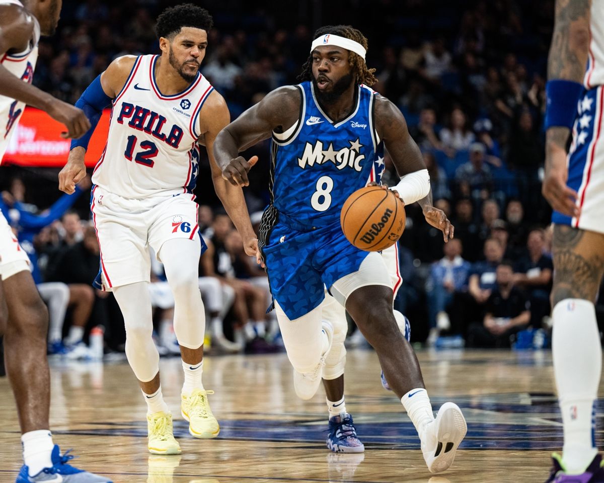 Jan 19, 2024; Orlando, Florida, USA; Orlando Magic guard Kevon Harris (8) dribbles the ball against Philadelphia 76ers forward Tobias Harris (12) in the fourth quarter at KIA Center. Mandatory Credit: Jeremy Reper-Imagn Images