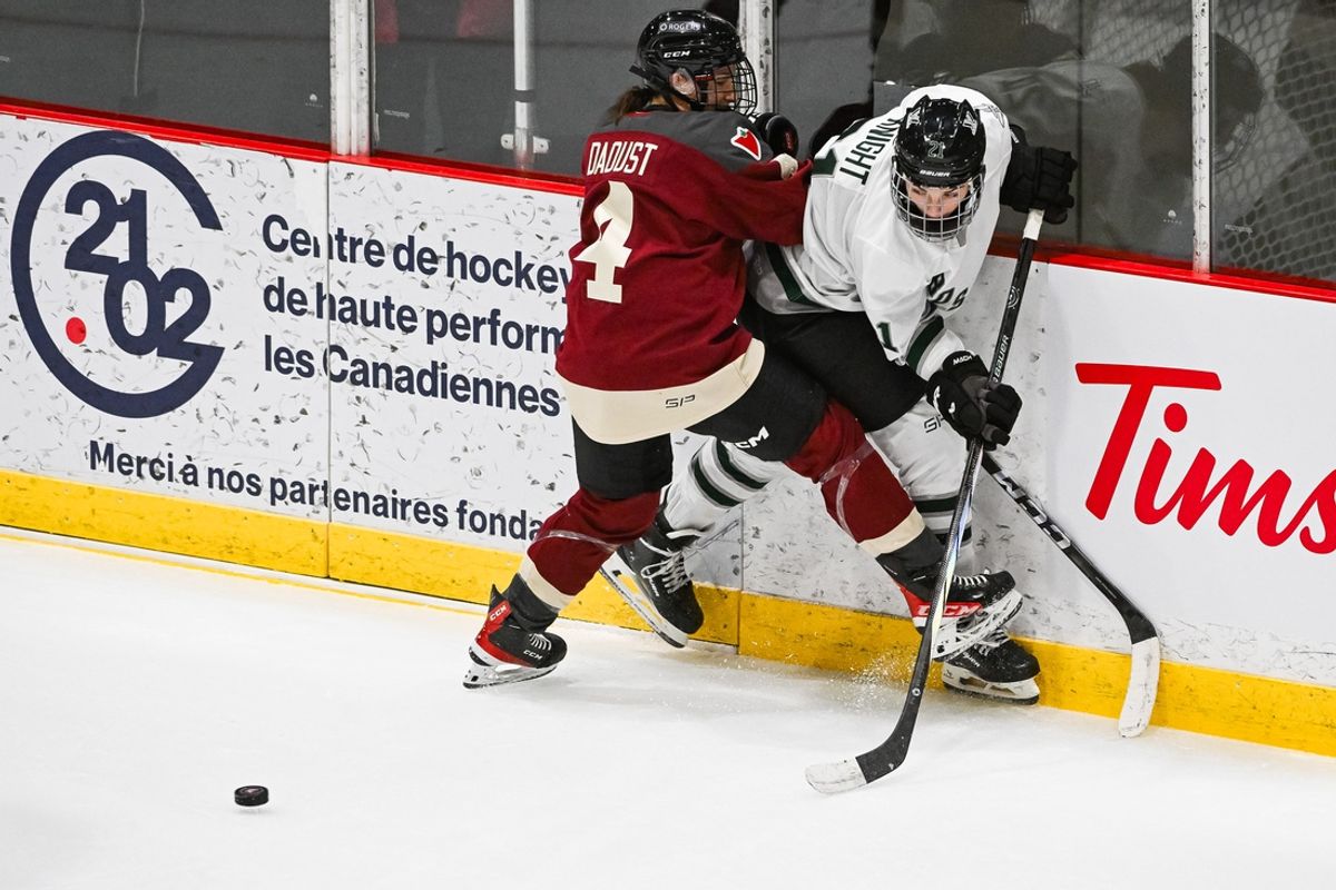 Jan 13, 2024; Montreal, Quebec, CANADA; Montreal defender Catherine Daoust (4) checks Boston forward Hilary Knight (21) during the second period in a PWHL ice hockey game at Verdun Auditorium. Mandatory Credit: David Kirouac-Imagn Images