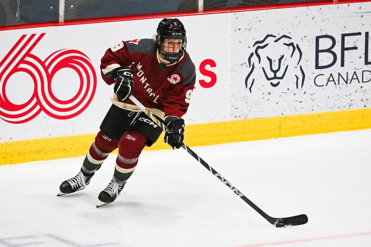 Jan 13, 2024; Montreal, Quebec, CANADA; Montreal defender Kati Tabin (9) plays the puck against Boston during the third period in a PWHL ice hockey game at Verdun Auditorium. Mandatory Credit: David Kirouac-Imagn Images