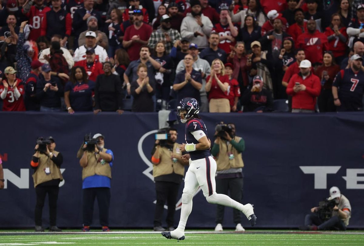 Jan 13, 2024; Houston, Texas, USA; Houston Texans quarterback C.J. Stroud (7) runs off the field after throwing a touchdown pass against the Cleveland Browns in a 2024 AFC wild card game at NRG Stadium. Mandatory Credit: Thomas Shea-USA TODAY Sports