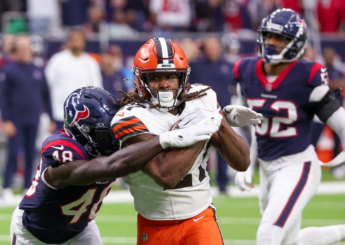 Jan 13, 2024; Houston, Texas, USA; Cleveland Browns running back Kareem Hunt (27) breaks the tackle of Houston Texans linebacker Christian Harris (48) as he scores a touchdown in a 2024 AFC wild card game at NRG Stadium. Mandatory Credit: Thomas Shea-Imagn Images