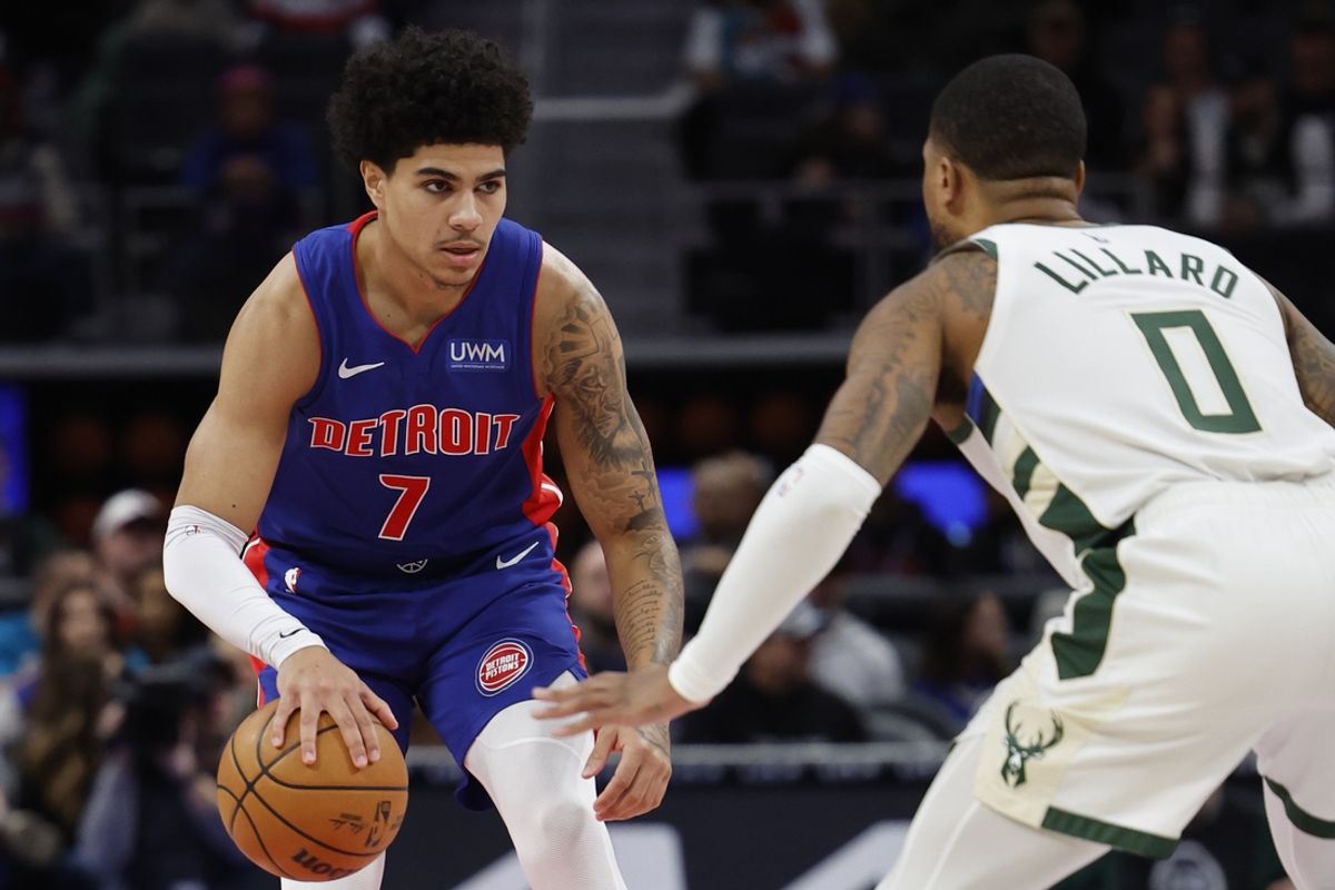 Jan 20, 2024; Detroit, Michigan, USA;  Detroit Pistons guard Killian Hayes (7) dribbles while defended by Milwaukee Bucks guard Damian Lillard (0) in the first half at Little Caesars Arena. Mandatory Credit: Rick Osentoski-Imagn Images