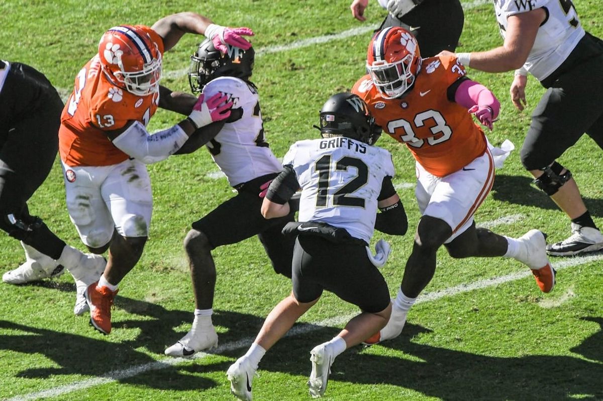 Oct 7, 2023; Clemson, South Carolina, USA; Clemson defensive tackle Ruke Orhorhoro (33) sacks  Wake Forest quarterback Mitch Griffis (12) during the first quarter at Memorial Stadium.