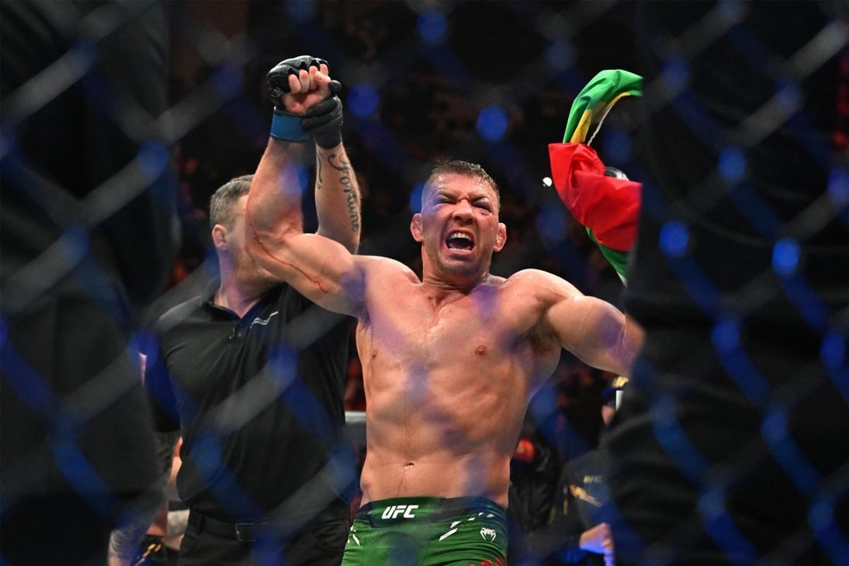 Jan 20, 2024; Toronto, Canada, USA; Dricus Du Plessis (blue gloves) celebrates defeating Sean Strickland (red glove) during UFC 297 at ScotiaBank Arena. Mandatory Credit: Dan Hamilton-USA TODAY Sports