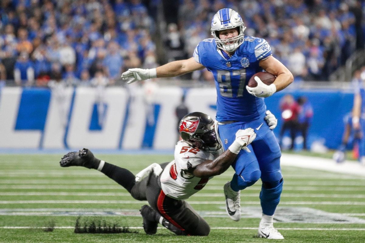 Detroit Lions tight end Sam LaPorta (87) runs for a first down against Tampa Bay Buccaneers linebacker K.J. Britt (52) during the second half of the NFC divisional round at Ford Field in Detroit on Sunday, Jan. 21, 2024.